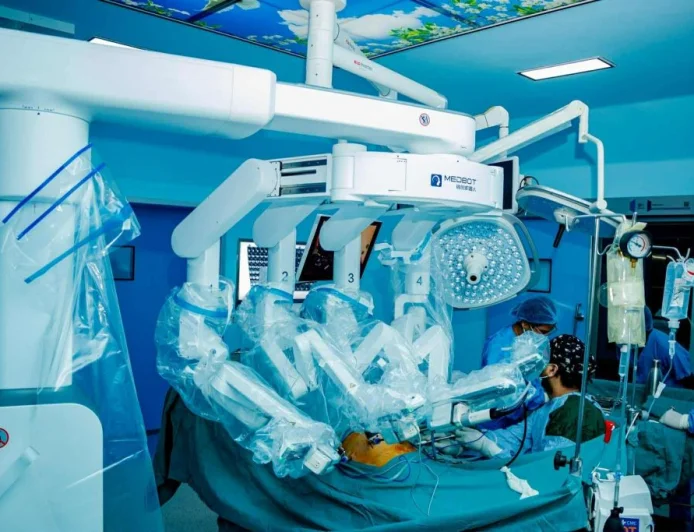 Doctor Observes Robot-Performed Surgery with Interest